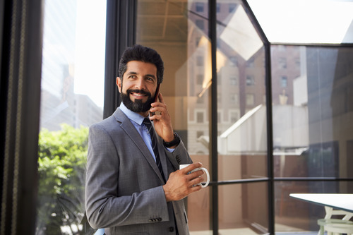 a business man in a suit, talking on the phone about employees career journey