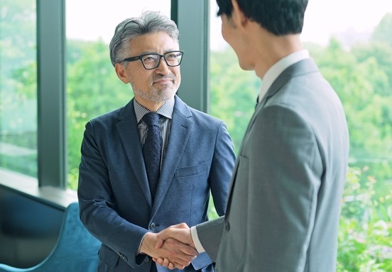 two businessmen shaking hands